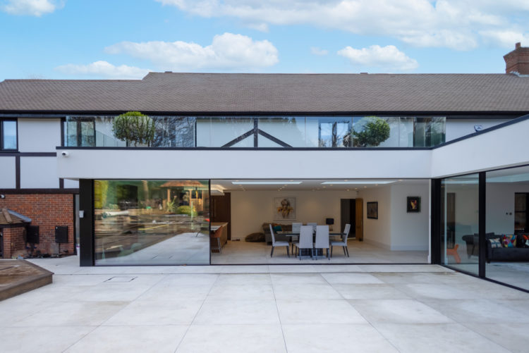 Ultraline black frameless sliding patio doors installation Chislehurst