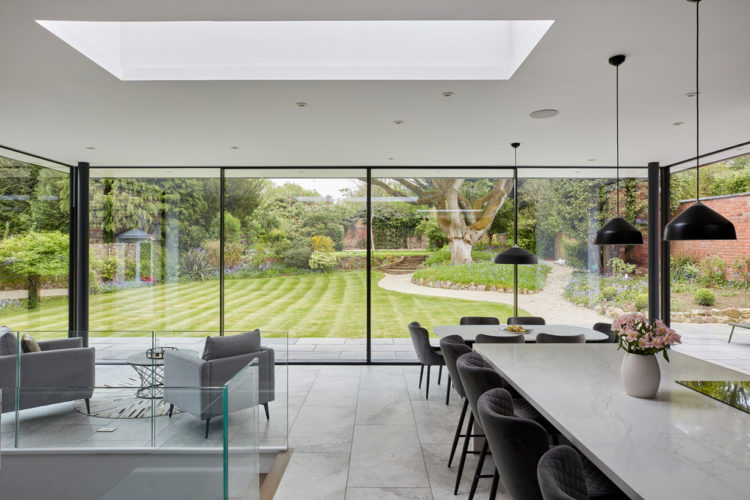 4 panel Ultraline sliding doors with frameless look installation modern glass box installation