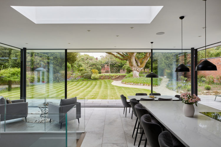 4 panel Ultraline sliding doors with frameless look installation modern glass box installation