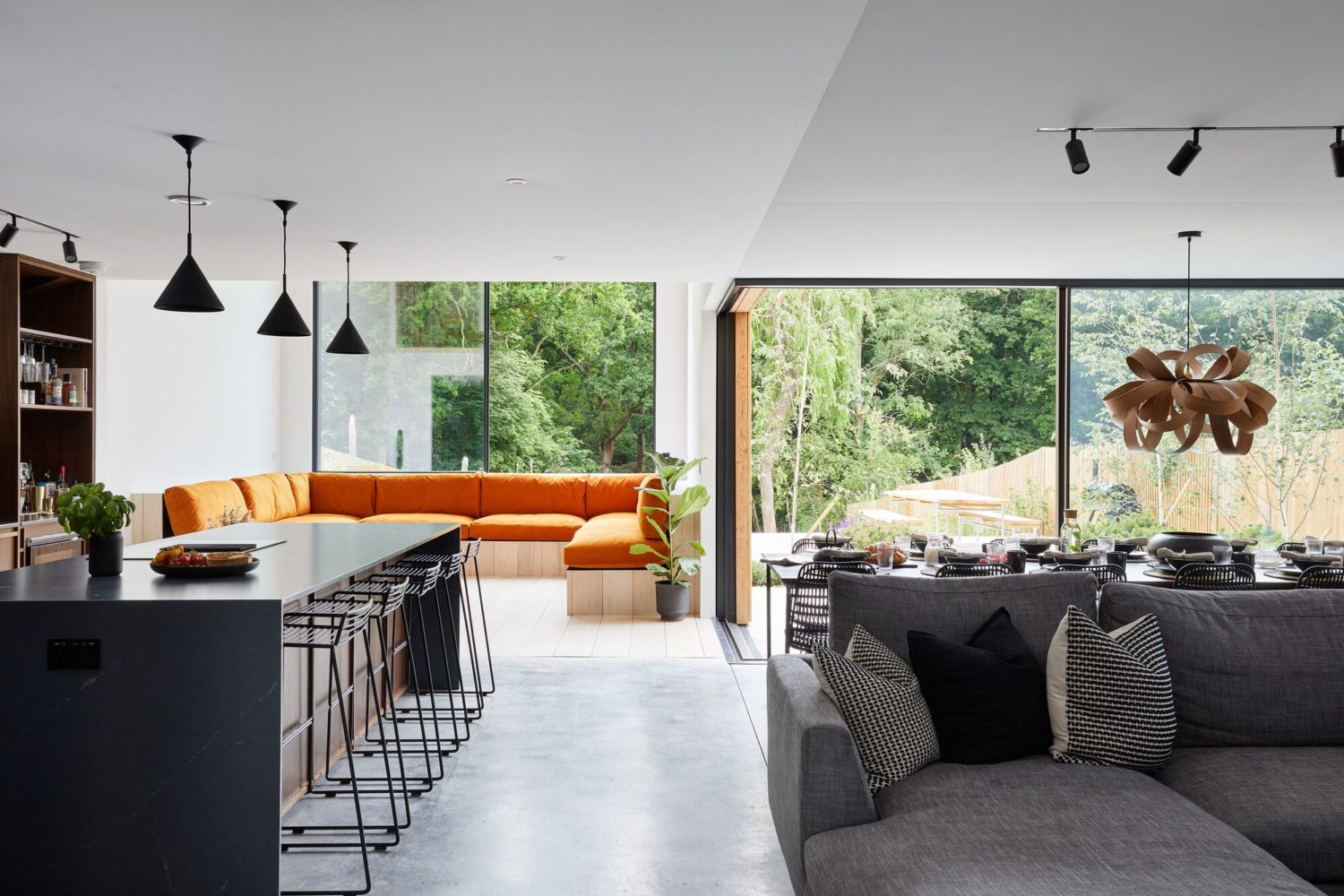 Black sliding doors with opening corners and slimline frames modern new build sliding doors with timber cladding