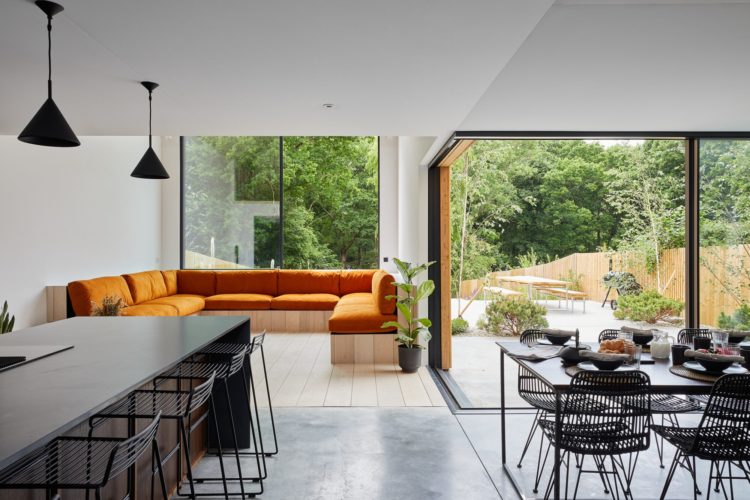 Black sliding doors with opening corners and slimline frames modern new build sliding doors with timber cladding