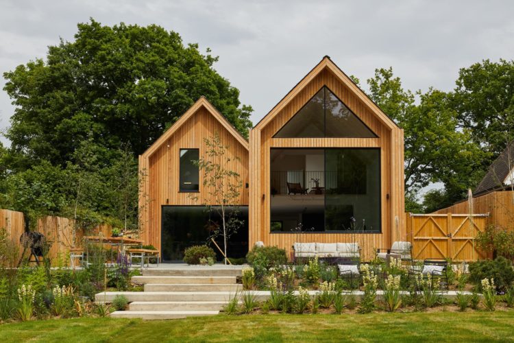 Black sliding doors with opening corners and slimline frames modern new build sliding doors with timber cladding